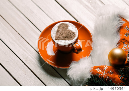 cup of coffee and christmas decorations 44970564