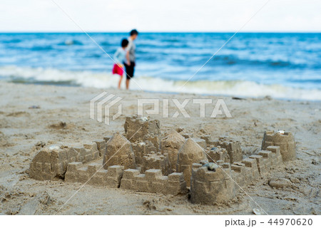 The sandcastle built by using the plastic models 44970620
