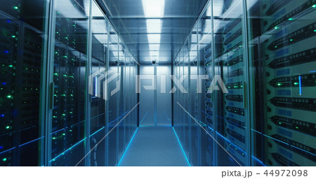 Long hallway full server racks in a modern data center 44972098