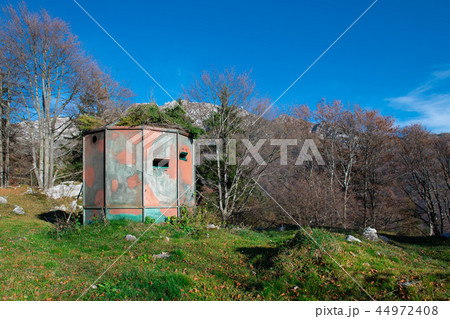 Hunting shed camouflaged in natural colors Hunting shed camouflaged in natural colors 44972408