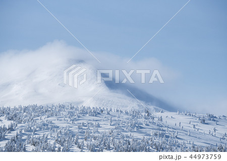 Mountain peak in the snow and clouds 44973759