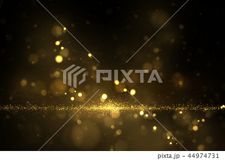 Shiny golden particles on dark 44974731