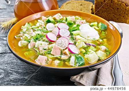 Okroshka in bowl with napkin on board 44978456