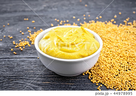 Sauce mustard in bowl on board Sauce mustard in bowl on board 44978995