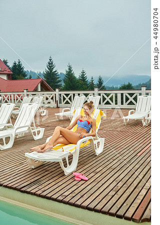 Summer lifestyle portrait of young stunning tanned woman. 44980704
