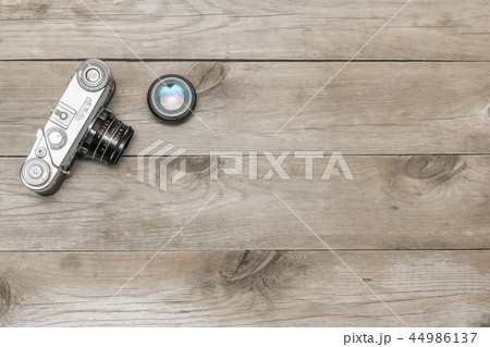 retro camera lying on the aged boards retro camera lying on the aged boards 44986137