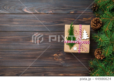 Christmas gift box wrapped in recycled paper Christmas gift box wrapped in recycled paper 44986624