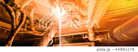 Process of fiberglass production at manufacture background with industry equipment 44991276