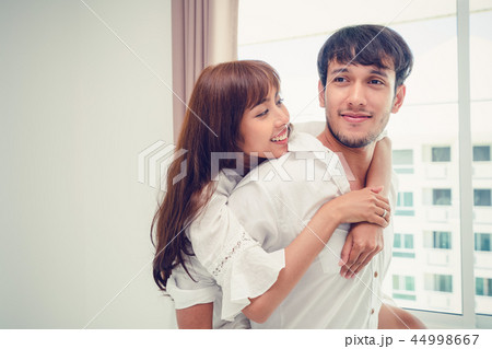 Happy young couple relaxing in the home bedroom. Happy young couple relaxing in the home bedroom. 44998667