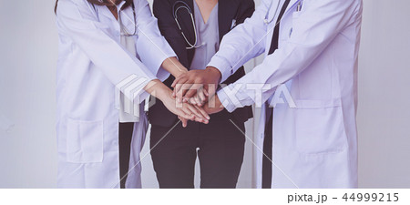 Doctors and Nurses coordinate hands. Doctors and Nurses coordinate hands. 44999215