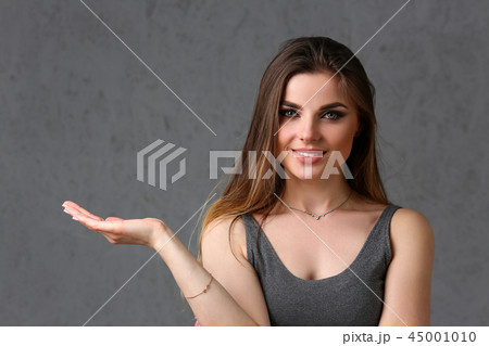 A caucasian woman on a gray background 45001010