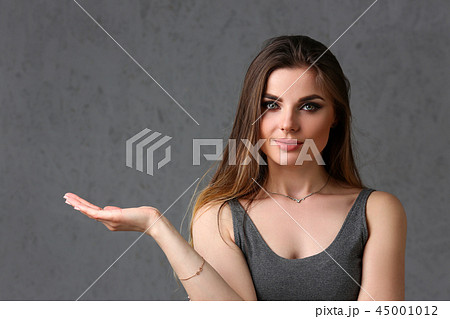 A caucasian woman on a gray background A caucasian woman on a gray background 45001012