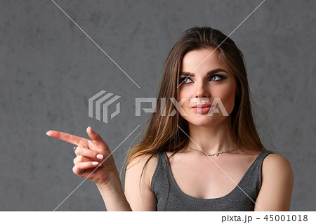 A caucasian woman on a gray background A caucasian woman on a gray background 45001018