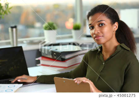 Beautiful smiling businesswoman portrait workplace 45001275