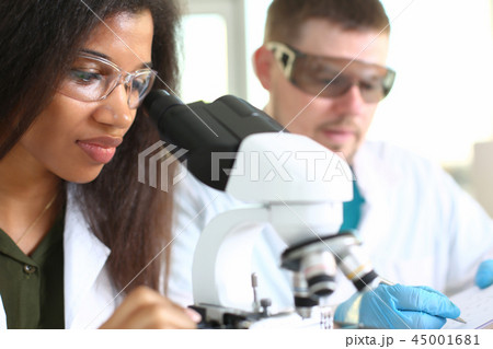 Two scientists of a student chemist are conducting Two scientists of a student chemist are conducting 45001681