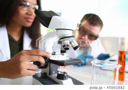 Two scientists of a student chemist are conducting 45001682