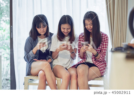 Woman using smartphone for the application. Woman using smartphone for the application. 45002911