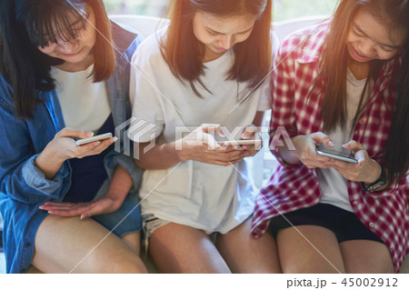Woman using smartphone for the application. 45002912