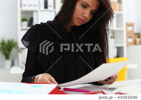 Beautiful smiling brunette woman sit at table Beautiful smiling brunette woman sit at table 45003696