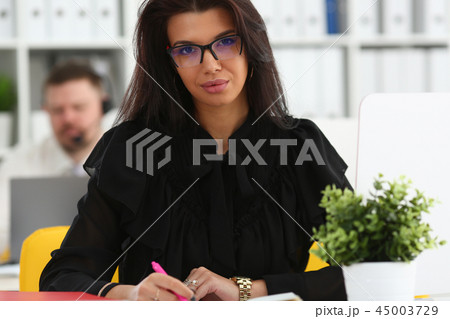 Beautiful smiling brunette woman hold in arms pink pen 45003729