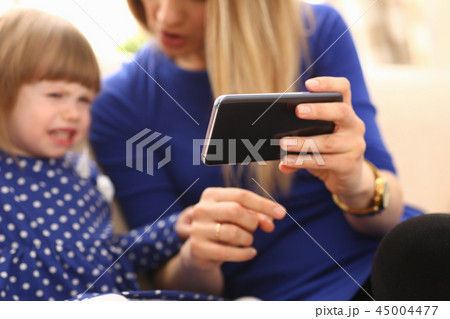 Cute little girl on floor carpet with mom Cute little girl on floor carpet with mom 45004477
