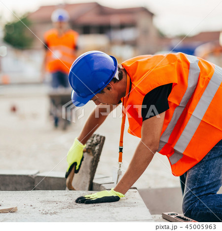 Manual workers on construction site 45005963