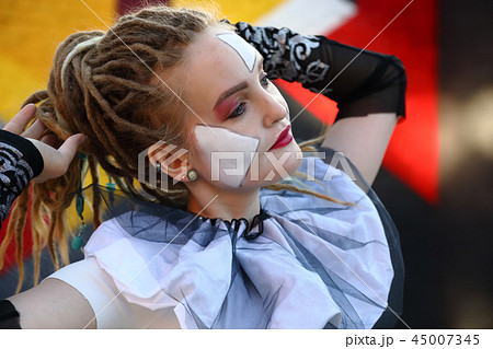 Young woman clown outdoors Young woman clown outdoors 45007345