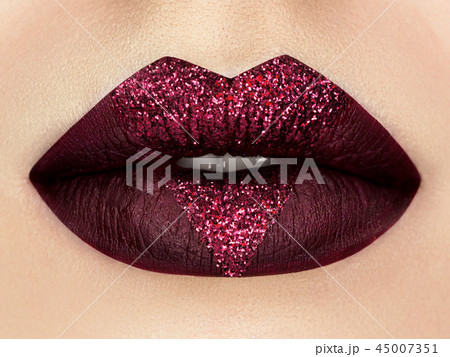Close up view of beautiful woman lips 45007351