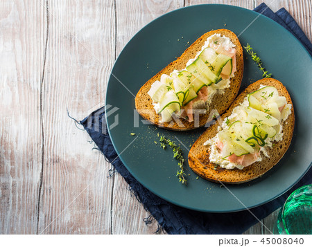 Rye bread toasts with cheese, ham, cucumber Rye bread toasts with cheese, ham, cucumber 45008040