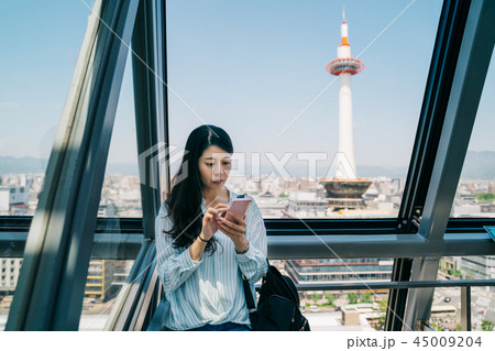 young office lady checking the timetable young office lady checking the timetable 45009204