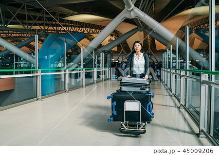 Asian woman going for business trip by plane. 45009206