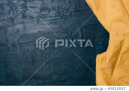 Navy blue kitchen background with yellow napkin Navy blue kitchen background with yellow napkin 45011037