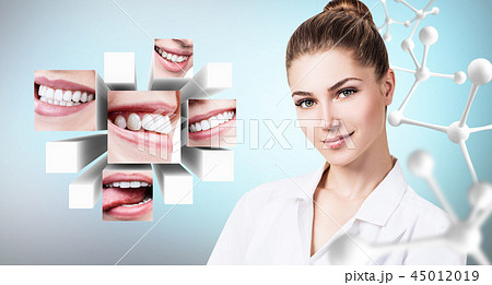 Young dentist doctor near collage of healthy beautiful smiles. 45012019