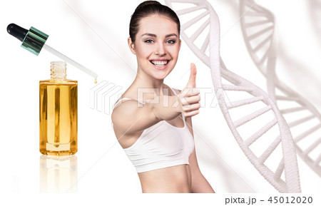 Cosmetic primer oil near beautiful woman with DNA chains. 45012020