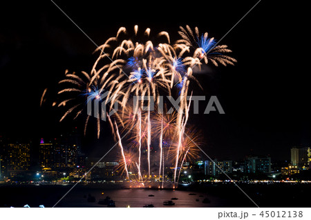 Fireworks explored over cityscape at night in sea 45012138