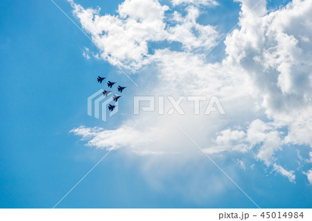 A group of military aircraft perform aerobatics 45014984