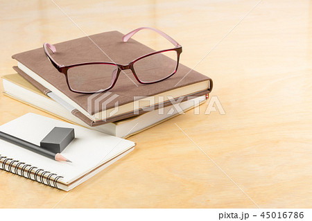 eyeglasses with books and stationary 45016786