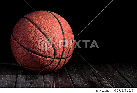 Basketball ball on a wooden floor 45018514