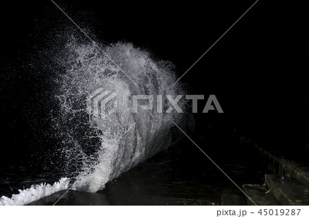 Splashing wave on the Black sea in the night. Splashing wave on the Black sea in the night. 45019287