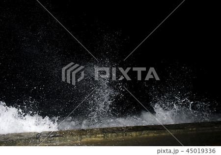 Splashing wave on the Black sea in the night. Splashing wave on the Black sea in the night. 45019336