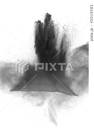 Black powder dust explosion on white background. 45019383