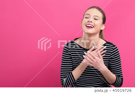 Woman with heartfelt expression 45019726