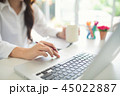 Hands of an office woman using laptop 45022887