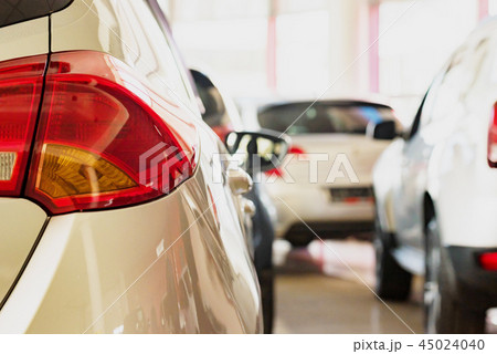 New cars at dealer showroom blurred background interior New cars at dealer showroom blurred background interior 45024040