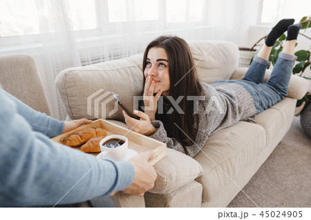 Man bringing breakfast to his girlfriend 45024905