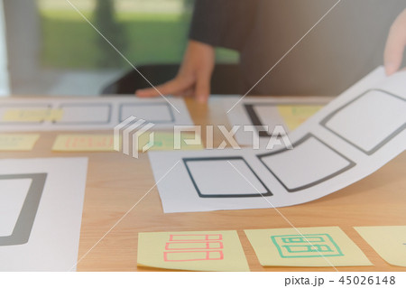user experience UX designer designing web on smartphone tablet layout. UI planning mobile application. developer work with business prototype user experience UX designer designing web on smartphone tablet layout. UI planning mobile application. developer work with business prototype 45026148
