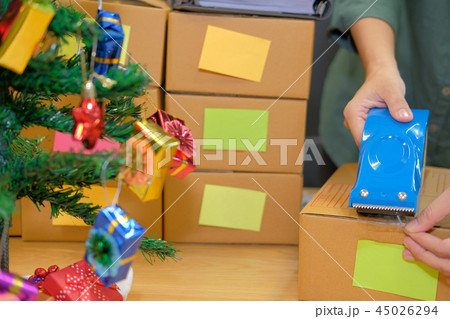 startup business owner packing cardboard box. man seller prepare parcel box. Online selling, e-commerce concept 45026294