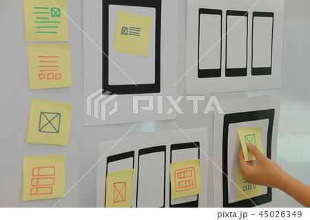 user experience UX designer designing web on mobile phone tablet layout. UI planning mobile application. developer work with business prototype user experience UX designer designing web on mobile phone tablet layout. UI planning mobile application. developer work with business prototype 45026349