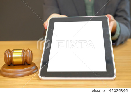 judge showinng white tablet screen. legal law gavel at courtroom. lawyer attorney justice at court 45026396
