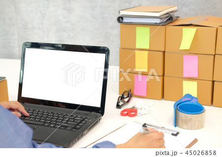 startup small business owner writing note. man seller working at home. Online selling, e-commerce concept startup small business owner writing note. man seller working at home. Online selling, e-commerce concept 45026858